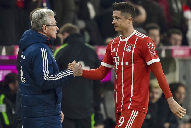 Bayern Munich's German head coach Jupp Heynckes shakes hands with Polish striker Robert Lewandowski as he leaves the pitch during the German first division Bundesliga football match Bayern Munich vs Werder Bremen in Munich, southern Germany, on January 21, 2018.
Bayern won 4-2. / AFP PHOTO / Guenter SCHIFFMANN / RESTRICTIONS: DURING MATCH TIME: DFL RULES TO LIMIT THE ONLINE USAGE TO 15 PICTURES PER MATCH AND FORBID IMAGE SEQUENCES TO SIMULATE VIDEO. == RESTRICTED TO EDITORIAL USE == FOR FURTHER QUERIES PLEASE CONTACT DFL DIRECTLY AT + 49 69 650050
        (Photo credit should read GUENTER SCHIFFMANN/AFP/Getty Images)
