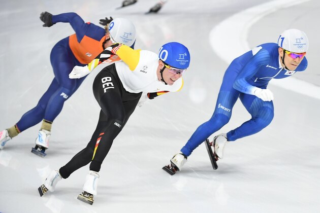 R-L: South Korea's Lee Seung-Hoon, Belgium's Bart Swings and Netherlands' Koen Verweij compete in the men's mass start final speed skating event during the Pyeongchang 2018 Winter Olympic Games at the Gangneung Oval in Gangneung on February 24, 2018. / AFP PHOTO / Roberto SCHMIDT        (Photo credit should read ROBERTO SCHMIDT/AFP/Getty Images)