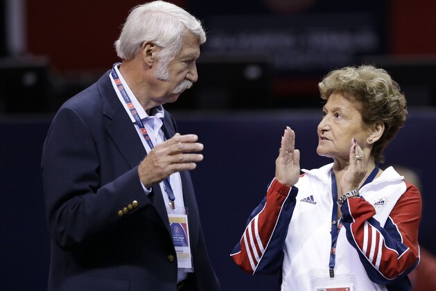 FILE - In this June 29, 2012, file photo, Bela Karolyi, left, and his wife Martha Karolyi talk on the arena floor before the start of the preliminary round of the women's Olympic gymnastics trials in San Jose, Calif. The latest lawsuit filed Thursday, Oct. 27, 2016, accusing Dr. Larry Nassar, a former USA Gymnastics doctor, of sexually abusing a longtime member of the U.S. women's national team is the first to name renowned husband-and-wife coaches Bela and Martha Karolyi, alleging they turned a blind eye to molestations. The Karolyis did not return messages seeking comment. (AP Photo/Gregory Bull, File)