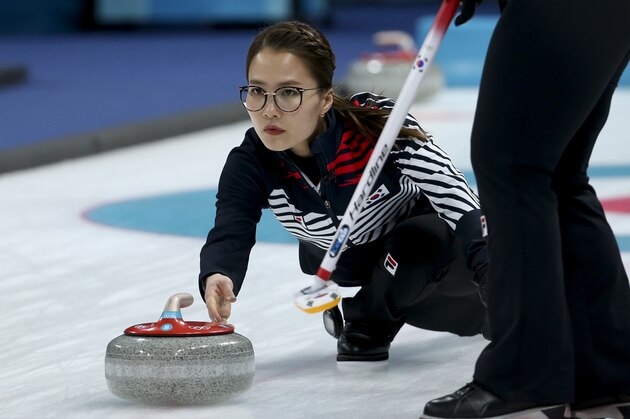GANGNEUNG, SOUTH KOREA - FEBRUARY 23: Eun Jung Kim of South Korea throws a stone during the women's curling semifinal game between Republic of Korea and Japan on day fourteen of the 2018 Winter Olympic Games at Gangneung Curling Centre on February 23, 2018 in Gangneung, South Korea. (Photo by Jean Catuffe/Getty Images)