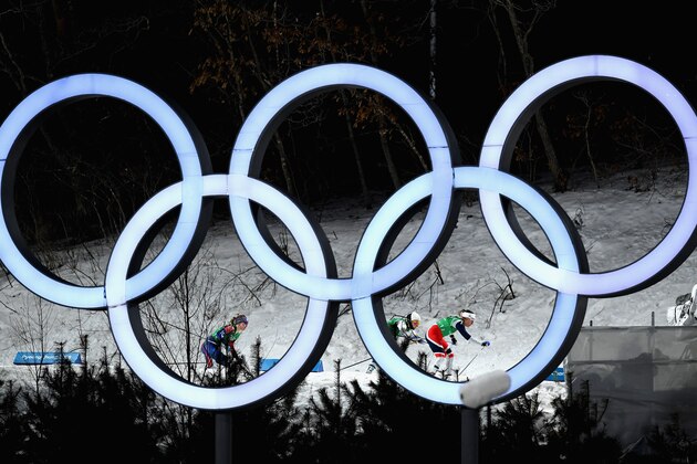 PYEONGCHANG-GUN, SOUTH KOREA - FEBRUARY 21:  Stina Nilsson of Sweden, Maiken Caspersen Falla of Norway and Jessica Diggins of the United States compete as they pass the Olympic Rings during the Cross Country Ladies' Team Sprint Free Final on day 12 of the PyeongChang 2018 Winter Olympic Games at Alpensia Cross-Country Centre on February 21, 2018 in Pyeongchang-gun, South Korea.  (Photo by Matthias Hangst/Getty Images)