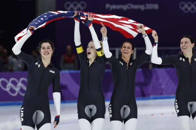 Bronze medalist team U.S.A. with Heather Bergsma, right, Brittany Bowe, second right, Mia Manganello, second left, and Carlijn Schoutens, left, celebrates after the women's team pursuit final speedskating race at the Gangneung Oval at the 2018 Winter Olympics in Gangneung, South Korea, Wednesday, Feb. 21, 2018. (AP Photo/John Locher)