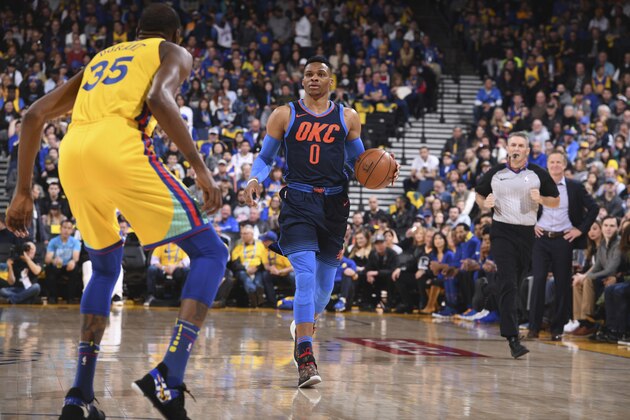 OAKLAND, CA - FEBRUARY 24: Russell Westbrook #0 of the Oklahoma City Thunder handles the ball against the Golden State Warriors on February 24, 2018 at ORACLE Arena in Oakland, California. NOTE TO USER: User expressly acknowledges and agrees that, by downloading and or using this photograph, user is consenting to the terms and conditions of Getty Images License Agreement. Mandatory Copyright Notice: Copyright 2018 NBAE (Photo by Garrett Ellwood/NBAE via Getty Images)