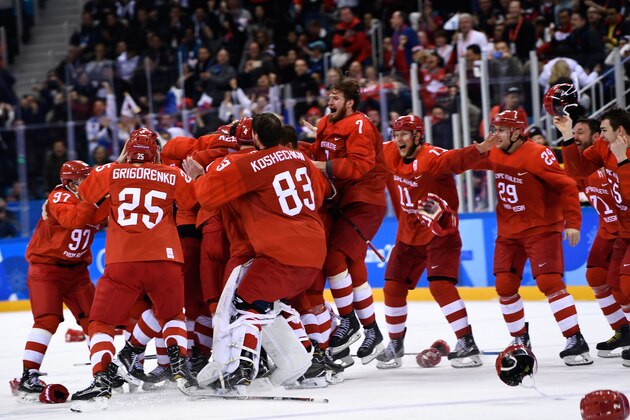 The Olympic Athletes from Russia celebrate winning the men's gold medal ice hockey match between the Olympic Athletes from Russia and Germany during the Pyeongchang 2018 Winter Olympic Games at the Gangneung Hockey Centre in Gangneung on February 25, 2018.   / AFP PHOTO / Brendan Smialowski        (Photo credit should read BRENDAN SMIALOWSKI/AFP/Getty Images)