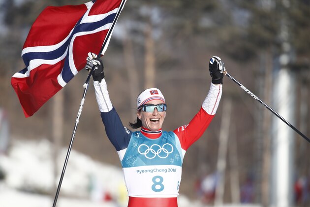 Norway's Marit Bjoergen celebrates her gold medal win in the women's 30km cross country mass start classic at the Alpensia cross country ski centre during the Pyeongchang 2018 Winter Olympic Games on February 25, 2018 in Pyeongchang.  / AFP PHOTO / Odd ANDERSEN        (Photo credit should read ODD ANDERSEN/AFP/Getty Images)