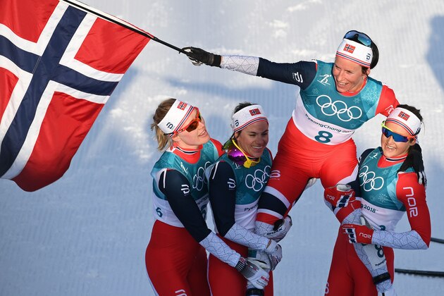 Norway's Marit Bjoergen (2nd R) is carried by her teammates after winning the women's 30km cross country mass start classic at the Alpensia cross country ski centre during the Pyeongchang 2018 Winter Olympic Games in Pyeongchang on February 25, 2018.  / AFP PHOTO / FRANCK FIFE        (Photo credit should read FRANCK FIFE/AFP/Getty Images)
