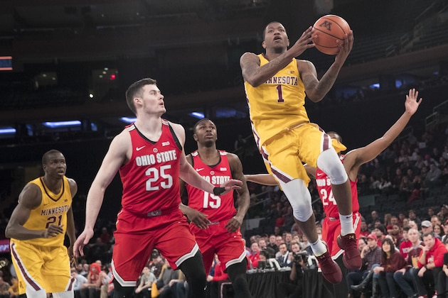 Minnesota guard Dupree McBrayer (1) goes to the basket past Ohio State forward Kyle Young (25) guard Kam Williams (15) and forward Andre Wesson during the first half of an NCAA college basketball game, Saturday, Jan. 20, 2018, at Madison Square Garden in New York. (AP Photo/Mary Altaffer)