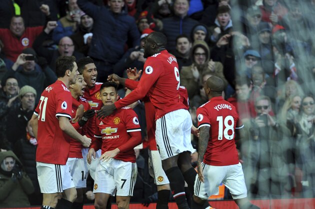 Manchester United's Jesse Lingard, second left, celebrates with his teammates after scoring his side's second goal during the English Premier League soccer match between Manchester United and Chelsea at the Old Trafford stadium in Manchester, England, Sunday, Feb. 25, 2018. (AP Photo/Rui Vieira)