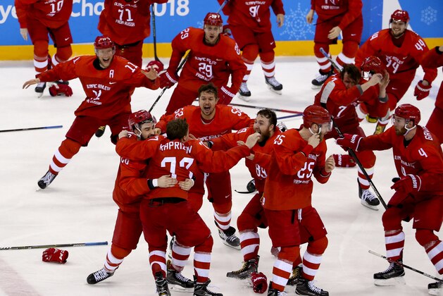GANGNEUNG, SOUTH KOREA - FEBRUARY 25: Players of Olympic Athlete from Russia celebrate winning the gold medal following the Men's Ice Hockey Gold Medal match between Germany and Olympic Athlete from Russia on day sixteen of the PyeongChang 2018 Winter Olympic Games at Gangneung Hockey Centre on February 25, 2018 in Gangneung, South Korea. (Photo by Jean Catuffe/Getty Images)
