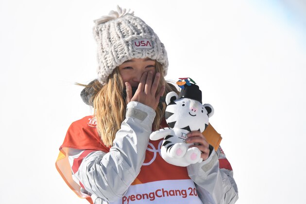 Gold medallist US Chloe Kim celebrates during the victory ceremony after the women's snowboard halfpipe final event at the Phoenix Park during the Pyeongchang 2018 Winter Olympic Games on February 13, 2018 in Pyeongchang. / AFP PHOTO / LOIC VENANCE        (Photo credit should read LOIC VENANCE/AFP/Getty Images)