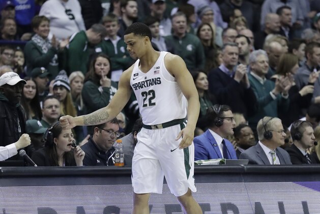 Michigan State guard/forward Miles Bridges walks on the court before an NCAA college basketball game against Northwestern, Saturday, Feb. 17, 2018, in Rosemont, Ill. (AP Photo/Nam Y. Huh)