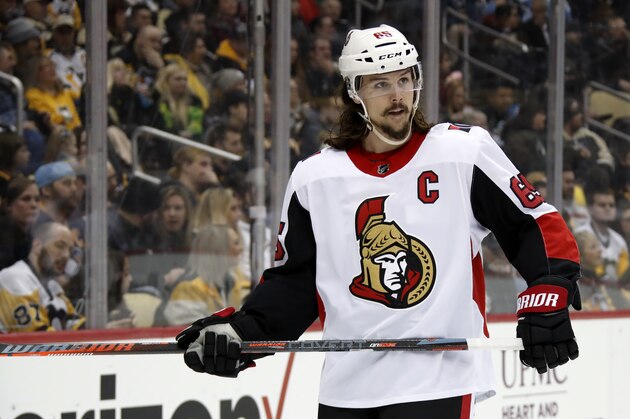 Ottawa Senators defenseman Erik Karlsson prepares for a face-off during an NHL hockey game against the Pittsburgh Penguins in Pittsburgh, Tuesday, Feb. 13, 2018. (AP Photo/Gene J. Puskar)