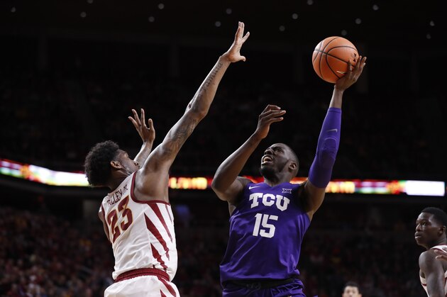 AMES, IA - FEBRUARY 21: JD Miller #15 of the TCU Horned Frogs takes a shot as Zoran Talley Jr. #23 of the Iowa State Cyclones blocks in the first half of play at Hilton Coliseum on February 21, 2018 in Ames, Iowa. TCU Horned Frogs won 89-83 over the Iowa State Cyclones. (Photo by David K Purdy/Getty Images)