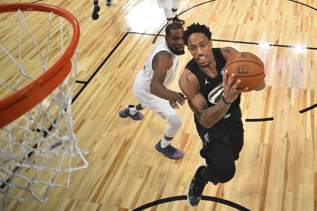 Team Stephen's DeMar Derozan, right, of the Toronto Raptors, shoots as Team LeBron's Kevin Durant, of the Golden State Warriors, defends during the second half of an NBA All-Star basketball game, Sunday, Feb. 18, 2018, in Los Angeles. (Bob Donnan via AP, Pool)