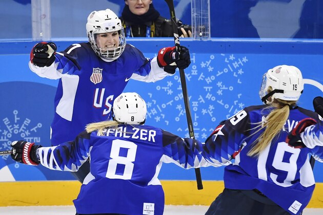 United States forward Monique Lamoureux-Morando (7) celebrates her goal against Canada with teammates defenceman Emily Pfalzer (8) and forward Gigi Marvin (19) during third period women's gold medal final Olympic hockey action at the 2018 Olympic Winter Games in Gangneung, South Korea on Thursday, February 22, 2018. (Nathan Denette/The Canadian Press via AP)