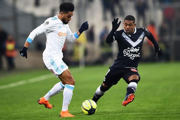 Olympique de Marseille's French defender Jordan Amavi (L) vies with Bordeaux's Brazilian forward Malcom (R) during the French L1 football match Marseille vs Bordeaux on February 18, 2018, at the Velodrome stadium in Marseille, Southern France. / AFP PHOTO / ANNE-CHRISTINE POUJOULAT        (Photo credit should read ANNE-CHRISTINE POUJOULAT/AFP/Getty Images)