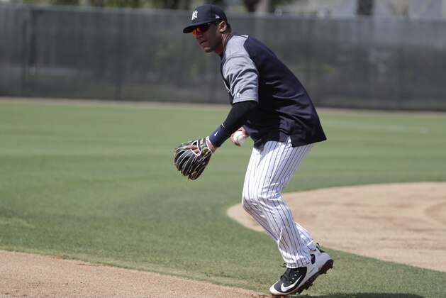 Seattle Seahawks NFL football team quarterback Russell Wilson does drills at New York Yankees baseball spring training camp, Monday, Feb. 26, 2018, in Tampa, Fla. (AP Photo/Lynne Sladky)