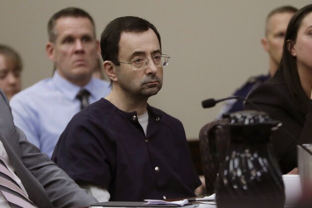 Larry Nassar sits during his sentencing hearing Wednesday, Jan. 24, 2018, in Lansing, Mich.  The former sports doctor who admitted molesting some of the nation's top gymnasts for years was sentenced Wednesday to 40 to 175 years in prison as the judge declared: