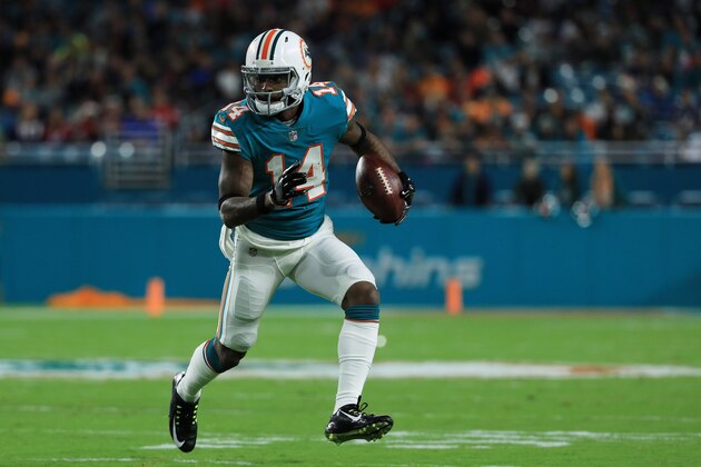 MIAMI GARDENS, FL - DECEMBER 11:   Jarvis Landry #14 of the Miami Dolphins carries the ball in the first quarter against the New England Patriots at Hard Rock Stadium on December 11, 2017 in Miami Gardens, Florida.  (Photo by Mike Ehrmann/Getty Images)