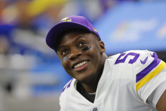 Minnesota Vikings quarterback Teddy Bridgewater smiles on the bench against the Detroit Lions during an NFL football game in Detroit, Thursday, Nov. 23, 2017. (AP Photo/Paul Sancya)