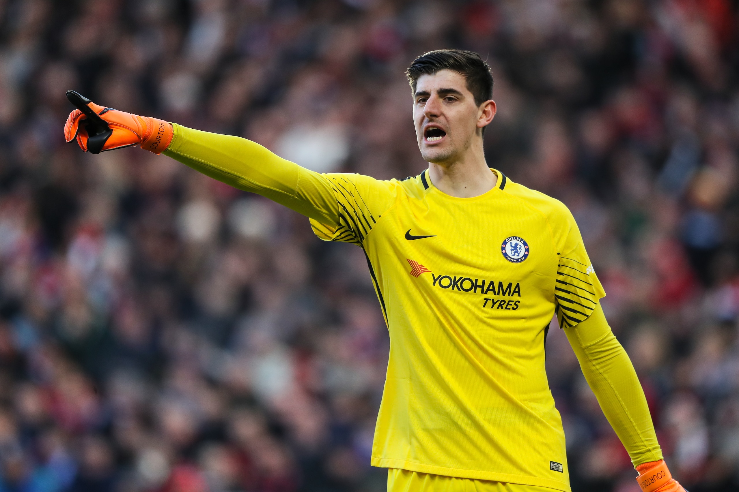 MANCHESTER, ENGLAND - FEBRUARY 25: Thibaut Courtois of Chelsea points during the Premier League match between Manchester United and Chelsea at Old Trafford on February 25, 2018 in Manchester, England. (Photo by Matthew Ashton - AMA/Getty Images)
