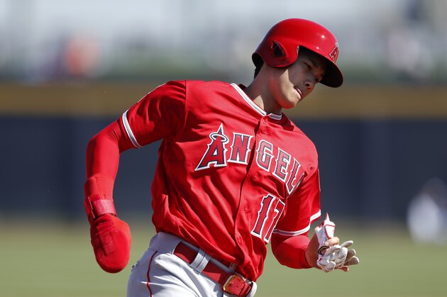 Los Angeles Angels' Shohei Ohtani runs to third base during the third inning of a spring training baseball game against the San Diego Padres, Monday, Feb. 26, 2018, in Peoria, Ariz. (AP Photo/Charlie Neibergall)