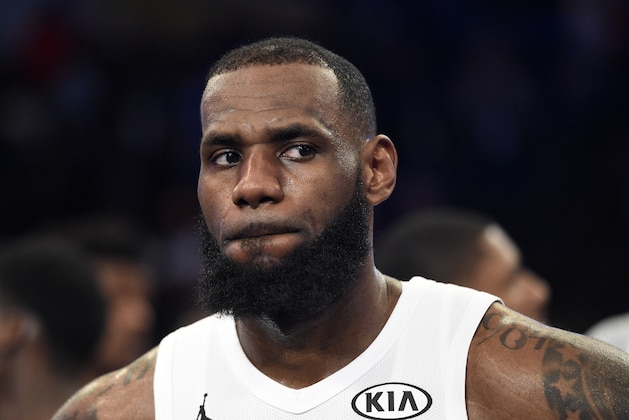 Team LeBron's LeBron James, of the Cleveland Cavaliers, looks on during the trophy ceremony following an NBA All-Star basketball game against Team Stephen, Sunday, Feb. 18, 2018, in Los Angeles. Team LeBron won 148-145. (AP Photo/Chris Pizzello)