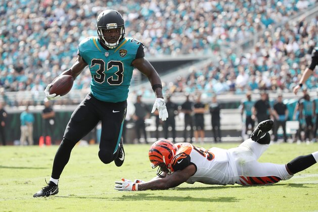 JACKSONVILLE, FL - NOVEMBER 05:  Chris Ivory #33 of the Jacksonville Jaguars runs with the football over  Vontaze Burfict #55 of the Cincinnati Bengals during the first half of their game at EverBank Field on November 5, 2017 in Jacksonville, Florida.  (Photo by Logan Bowles/Getty Images)