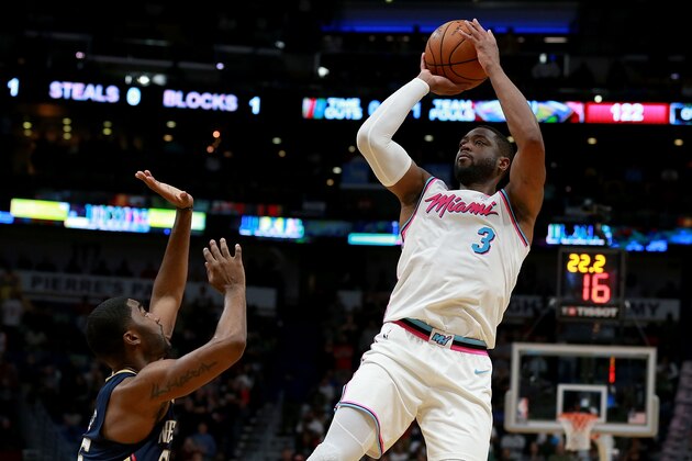 NEW ORLEANS, LA - FEBRUARY 23:  Dwyane Wade #3 of the Miami Heat shoots over Darius Miller #21 of the New Orleans Pelicans during a NBA game at the Smoothie King Center on February 23, 2018 in New Orleans, Louisiana. NOTE TO USER: User expressly acknowledges and agrees that, by downloading and or using this photograph, User is consenting to the terms and conditions of the Getty Images License Agreement.  (Photo by Sean Gardner/Getty Images)