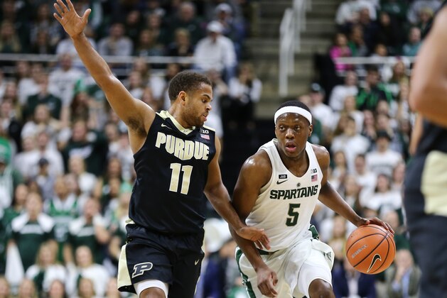 EAST LANSING, MI - FEBRUARY 10: Cassius Winston #5 of the Michigan State Spartans handles the ball while defended by  P.J. Thompson #11 of the Purdue Boilermakers at Breslin Center on February 10, 2018 in East Lansing, Michigan. (Photo by Rey Del Rio/Getty Images)
