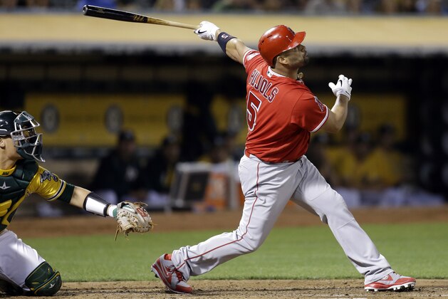 Los Angeles Angels' Albert Pujols watches his RBI sacrifice fly off Oakland Athletics' Kendall Graveman during the third inning of a baseball game Tuesday, Sept. 5, 2017, in Oakland, Calif. (AP Photo/Ben Margot)