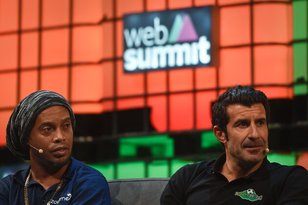 Former Brazilian football star Ronaldinho Gaucho (L) and football player Luis Figo (R) sit during a talk at the Web Summit at Parque das Nacoes, Lisbon on November 8, 2016.
Europe's largest tech event Web Summit will be held at Parque das Nacoes in Lisbon form Monday to Thursday, November 10.  / AFP / PATRICIA DE MELO MOREIRA        (Photo credit should read PATRICIA DE MELO MOREIRA/AFP/Getty Images)