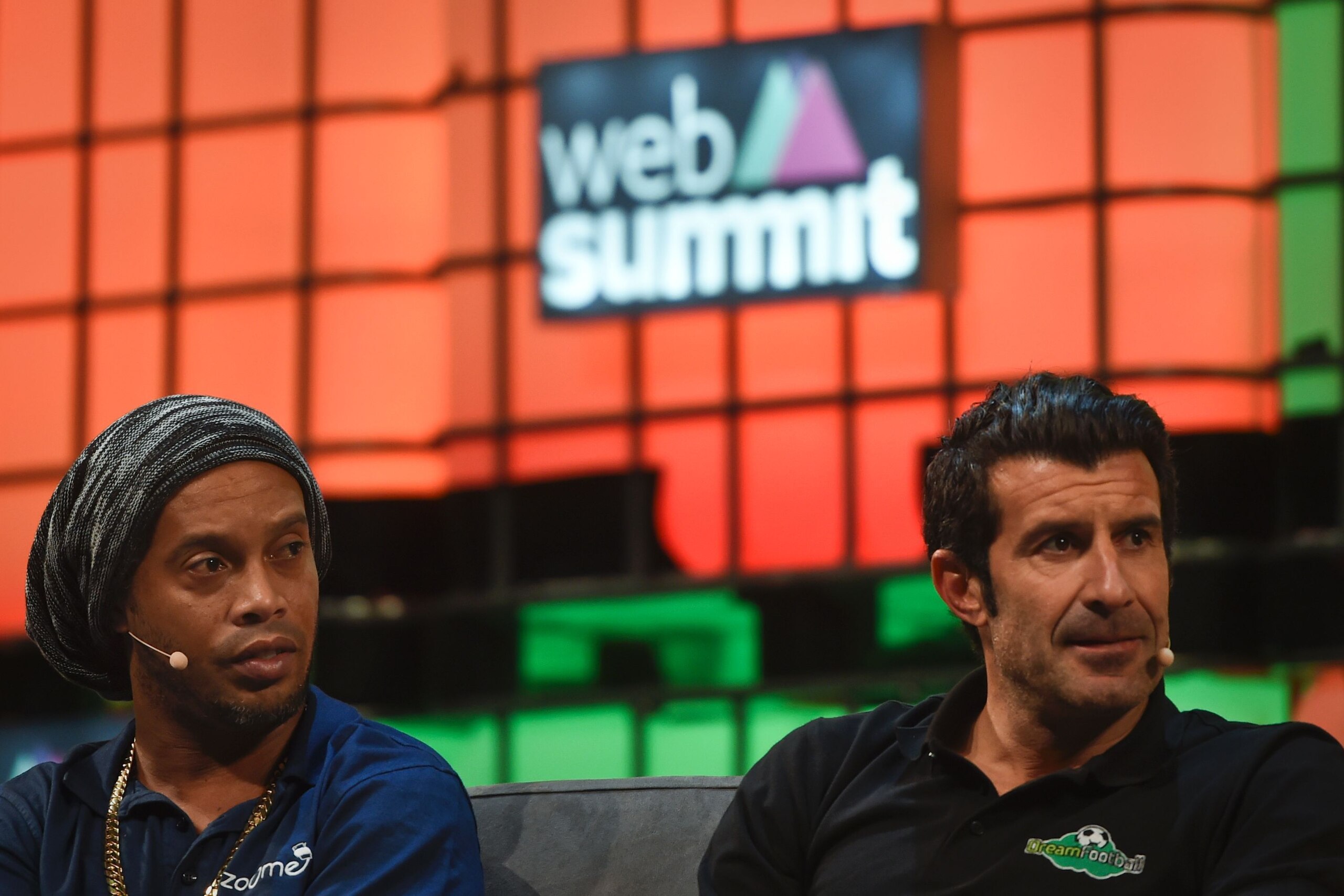Former Brazilian football star Ronaldinho Gaucho (L) and football player Luis Figo (R) sit during a talk at the Web Summit at Parque das Nacoes, Lisbon on November 8, 2016.
Europe's largest tech event Web Summit will be held at Parque das Nacoes in Lisbon form Monday to Thursday, November 10.  / AFP / PATRICIA DE MELO MOREIRA        (Photo credit should read PATRICIA DE MELO MOREIRA/AFP/Getty Images)
