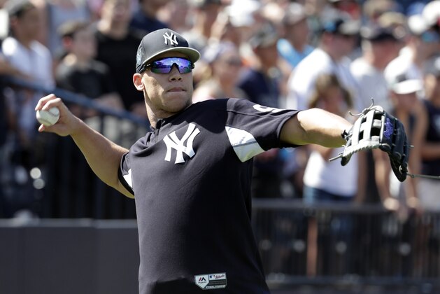 New York Yankees' Aaron Judge throws at baseball spring training camp, Monday, Feb. 19, 2018, in Tampa, Fla. (AP Photo/Lynne Sladky)