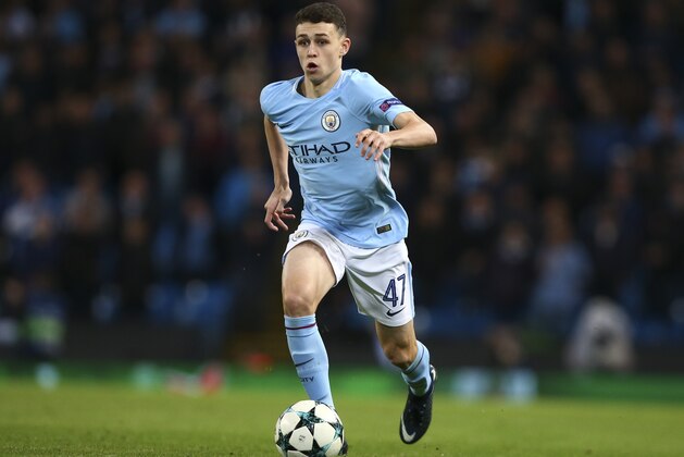 Manchester City's Phil Foden runs with the ball during the Champions League group F soccer match between Manchester City and Feyenoord, at the Etihad Stadium in Manchester, England, Tuesday, Nov. 21, 2017. (AP Photo/Dave Thompson)