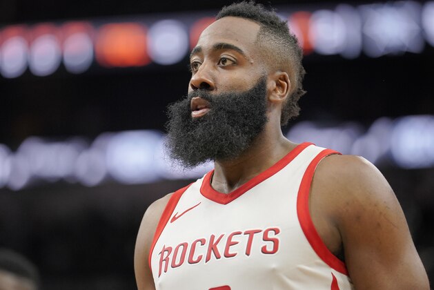 Houston Rockets' James Harden walks on to the court after a time out during the first half of an NBA basketball game against the San Antonio Spurs, Thursday, Feb. 1, 2018, in San Antonio. Houston won 102-91. (AP Photo/Darren Abate)