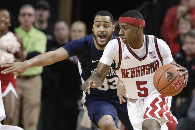 Nebraska's Glynn Watson Jr. (5) tries to drive around Penn State's Shep Garner (33) during the first half of an NCAA college basketball game in Lincoln, Neb., Sunday, Feb. 25, 2018. (AP Photo/Nati Harnik)