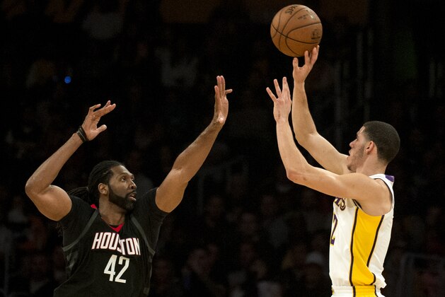 Houston Rockets center Nene Hilario (42), left, and Los Angeles Lakers guard Lonzo Ball (2) during the first half of an NBA basketball game, Sunday, Dec. 3, 2017, in Los Angeles. (AP Photo/Kyusung Gong)
