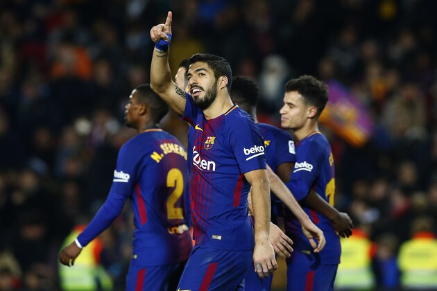 FC Barcelona's Luis Suarez celebrates after scoring during the Spanish La Liga soccer match between FC Barcelona and Girona at the Camp Nou stadium in Barcelona, Spain, Saturday, Feb. 24, 2018. (AP Photo/Manu Fernandez)