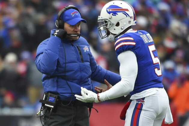 Buffalo Bills quarterback Tyrod Taylor (5) gestures while talking with head coach Sean McDermott against the Miami Dolphins during the first half of an NFL football game Sunday, December 17, 2017, in Orchard Park, N.Y. (AP Photo/Rich Barnes)
