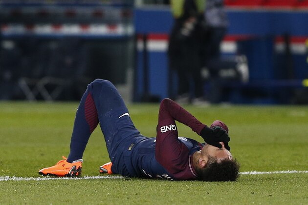 PSG's Neymar lays on the pitch after being fouled during the French League One soccer match between Paris Saint-Germain and Marseille at the Parc des Princes Stadium, in Paris, France, Sunday, Feb. 25, 2018. (AP Photo/Thibault Camus) PSG's Neymar lays on the pitch after being fouled during the French League One soccer match between Paris Saint-Germain and Marseille at the Parc des Princes Stadium, in Paris, France, Sunday, Feb. 25, 2018. (AP Photo/Thibault Camus)