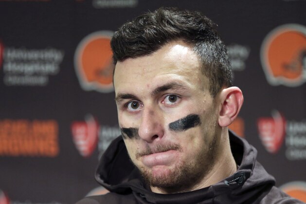 FILE - In this Dec. 20, 2015, file photo, Cleveland Browns quarterback Johnny Manziel speaks with media members following the team's 30-13 loss to the Seattle Seahawks in an NFL football game in Seattle. New Orleans Saints coach Sean Payton shot down a report that his team had interest in troubled quarterback Johnny Manziel. They did meet during Super Bowl week, but Payton called the report the team was considering adding Manziel