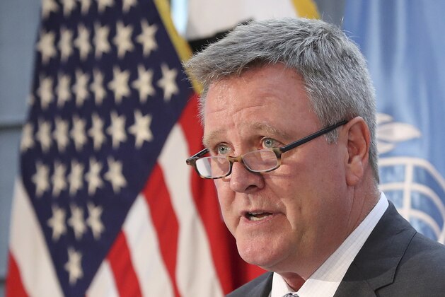 FILE - In this Aug. 1, 2017, file photo, Scott Blackmun, CEO of the U.S. Olympic Committee, speaks at Yongsan Garrison, a U.S. military base in Seoul, South Korea. Blackmun the leader of the U.S. Olympic Committee says the plan is to take a team to the Pyeongchang Games