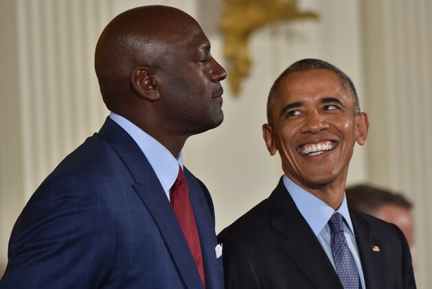 TOPSHOT - US President Barack Obama smiles before presenting former NBA basketball player Michael Jordan with the Presidential Medal of Freedom, the nation's highest civilian honor, during a ceremony honoring 21 recipients, in the East Room of the White House in Washington, DC, November 22, 2016. / AFP PHOTO / Nicholas Kamm        (Photo credit should read NICHOLAS KAMM/AFP/Getty Images)