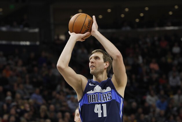 Dallas Mavericks' Dirk Nowitzki shoots a free throw in the first half of an NBA basketball game against the Utah Jazz on Saturday, Feb. 24, 2018, in Salt Lake City. (AP Photo/Kim Raff)