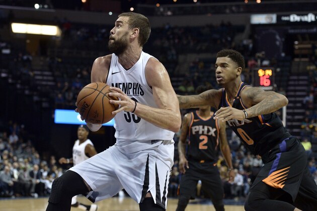 Memphis Grizzlies center Marc Gasol (33) drives against Phoenix Suns forward Marquese Chriss (0) in the first half of an NBA basketball game Wednesday, Feb. 28, 2018, in Memphis, Tenn. (AP Photo/Brandon Dill)