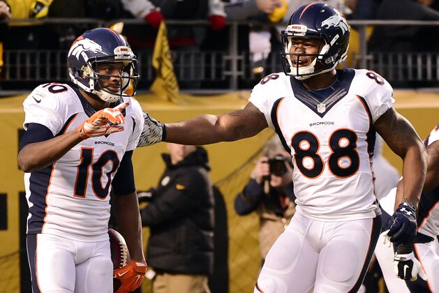 Denver Broncos wide receiver Emmanuel Sanders (10) celebrates his touchdown with teammate Demaryius Thomas (88) during the first half of an NFL football game against the Pittsburgh Steelers in Pittsburgh, Sunday, Dec. 20, 2015. (AP Photo/Fred Vuich)