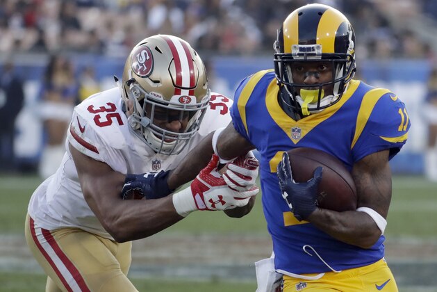Los Angeles Rams wide receiver Tavon Austin, right, breaks away from San Francisco 49ers strong safety Eric Reid during the second half of an NFL football game Sunday, Dec. 31, 2017, in Los Angeles. (AP Photo/Rick Scuteri)