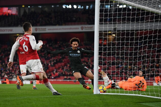 LONDON, ENGLAND - MARCH 01:  Leroy Sane of Manchester City scores the third goal past Petr Cech of Arsenal during the Premier League match between Arsenal and Manchester City at Emirates Stadium on March 1, 2018 in London, England.  (Photo by Shaun Botterill/Getty Images)