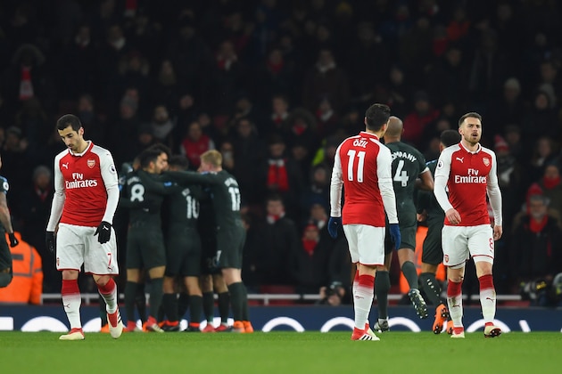 LONDON, ENGLAND - MARCH 01: Henrikh Mkhitaryan, Mesut Ozil and Aaron Ramsey of Arsenal are dejected after the 2nd Man City goal during the Premier League match between Arsenal and Manchester City at Emirates Stadium on March 1, 2018 in London, England.  (Photo by Mike Hewitt/Getty Images)